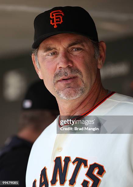 Manager Bruce Bochy of the San Francisco Giants watches from the dugout during the game between the San Diego Padres and the San Francisco Giants on...