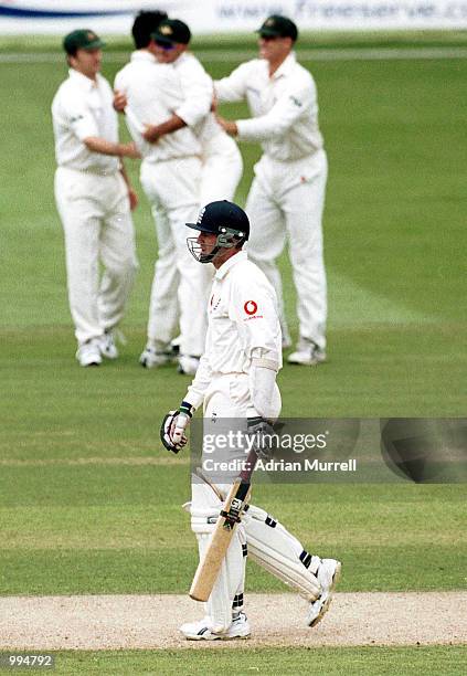 The Australian celebrate as Dominic Cork of England walks back to the pavilion during the second day of the Second Npower Test between Engalnd and...