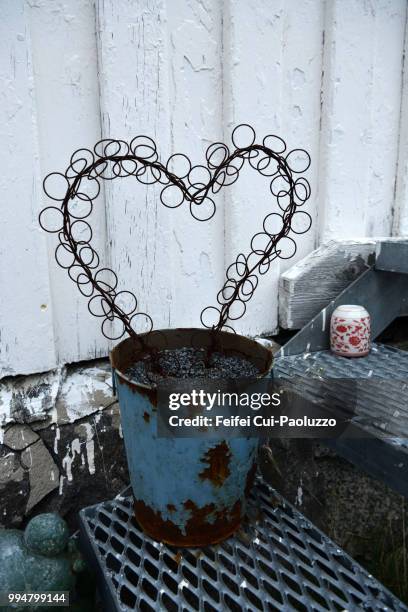 sculpture of a heart shape in a pot at risøyhamn, andøya island, norway - flower pot island stock pictures, royalty-free photos & images