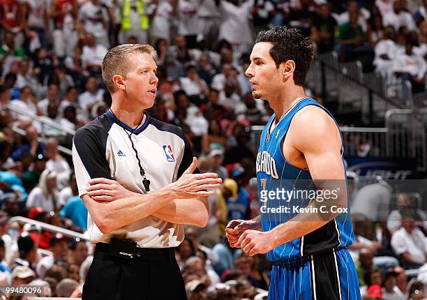 Referee Ed Malloy converses with J.J. Redick of the Orlando Magic against the Atlanta Hawks during Game Three of the Eastern Conference Semifinals...