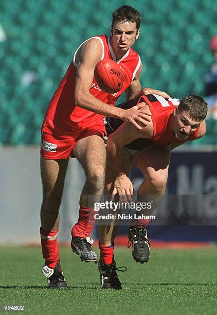 Nick Stodulka of the Redbacks and Adam DeLooze of Pennant Hills chase the ball during the Sydney AFL match between Pennant Hills and the Sydney...