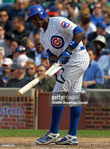 Alfonso Soriano of the Chicago Cubs throws down his bat and padding after striking out in the 8th inning against the Pittsburgh Pirates at Wrigley...