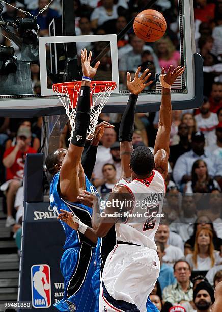 Dwight Howard of the Orlando Magic and Joe Johnson of the Atlanta Hawks during Game Three of the Eastern Conference Semifinals during the 2010 NBA...