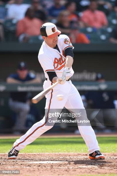 Mark Trumbo of the Baltimore Orioles takes a swing during a baseball game against the Seattle Mariners at Oriole Park at Camden Yards on June 28,...