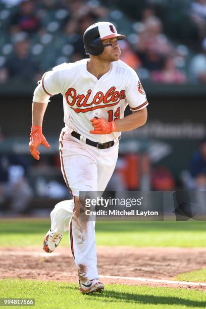 Chris Davis of the Baltimore Orioles runs to first base during a baseball game against the Seattle Mariners at Oriole Park at Camden Yards on June...