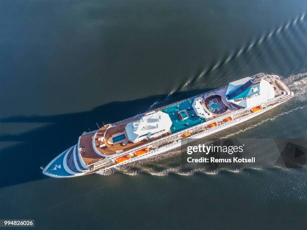 artania cruiser ship passing by in the stockholm swedish archipelago - remus kotsell stock pictures, royalty-free photos & images