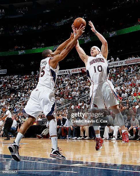 Al Horford and Mike Bibby of the Atlanta Hawks against the Orlando Magic during Game Three of the Eastern Conference Semifinals during the 2010 NBA...