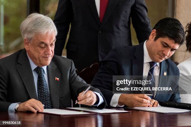 Chilean President Sebastian Pinera and Costa Rican President Carlos Alvarado sign bilateral agreements at the presidential house in San Jose, July 9,...