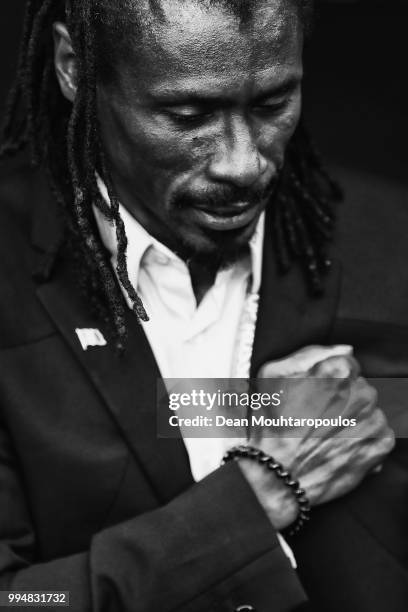 Manager / Head Coach of Senegal, Aliou Cisse puts his hand to his heart after the national anthem prior to the 2018 FIFA World Cup Russia group H...