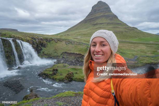 selfie portrait of tourist female in iceland at kirkjufell mountain - west central iceland stock pictures, royalty-free photos & images