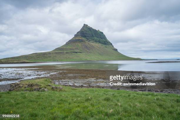 spectacular kirkjufell mountain in iceland against overcast sky, no people - west central iceland stock pictures, royalty-free photos & images