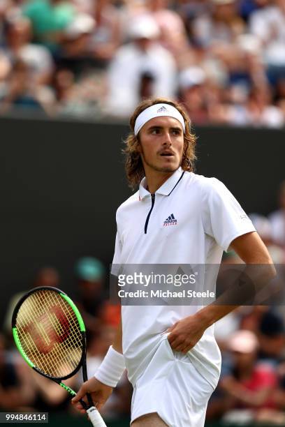 Stefanos Tsitsipas of Greece reacts during his Men's Singles fourth round match against John Isner of the United States on day seven of the Wimbledon...