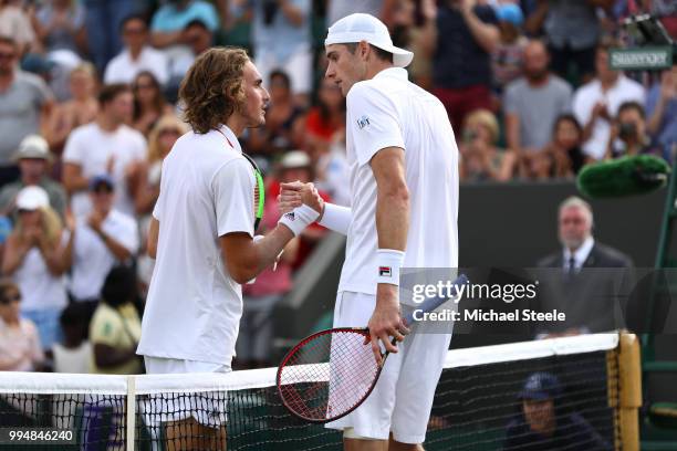 Stefanos Tsitsipas of Greece shakes hands with John Isner of the United States after their Men's Singles fourth round match on day seven of the...