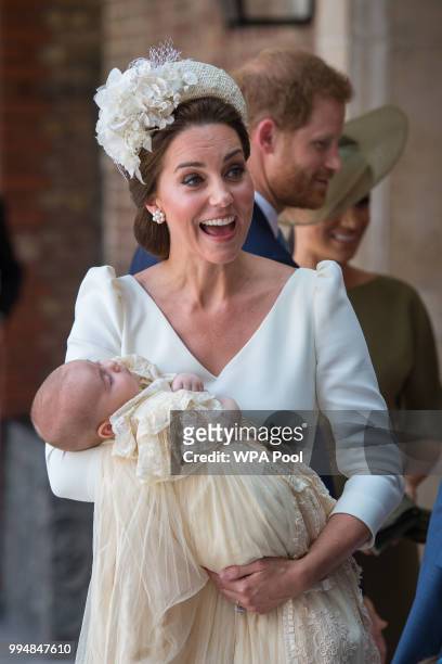 Catherine, Duchess of Cambridge carries Prince Louis of Cambridge at his christening service at St James's Palace on July 09, 2018 in London, England.