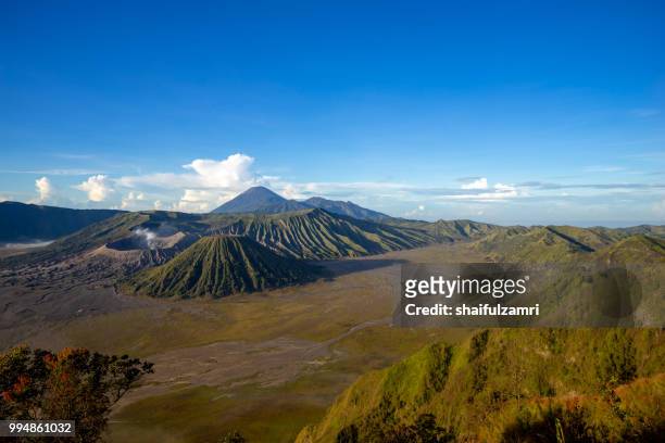 beautiful view landscape of active volcano crater with smoke at mt. bromo, east java, indonesia. - bromo crater 個照片及圖片檔