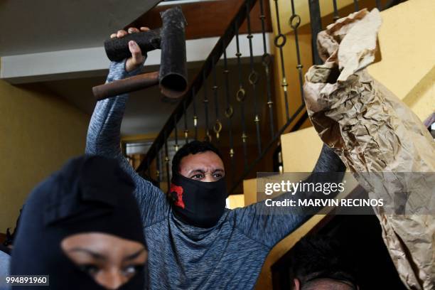 Paramilitaries burst into the San Sebastian Basilica, in Diriamba, Nicaragua on July 09, 2018. Supporters of the government of Nicaraguan President...