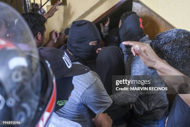 Paramilitaries burst into the San Sebastian Basilica, in Diriamba, Nicaragua on July 09, 2018. - Supporters of the government of Nicaraguan President...