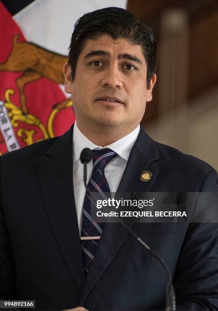 Costa Rican President Carlos Alvarado speaks during a joint press conference with Chilean President Sebastian Pinera after signing bilateral...