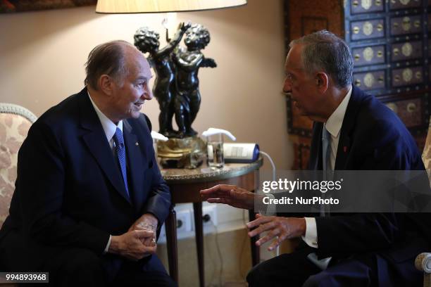 Portugal's President Marcelo Rebelo de Sousa chats with Prince Karim Aga Khan IV during an official visit at the Belem Palace in Lisbon, Portugal, on...