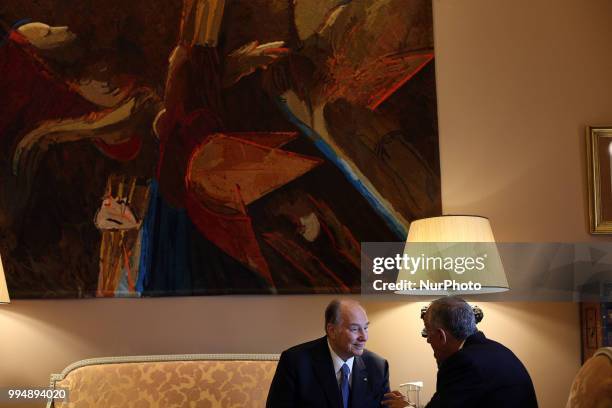 Portugal's President Marcelo Rebelo de Sousa chats with Prince Karim Aga Khan IV during an official visit at the Belem Palace in Lisbon, Portugal, on...