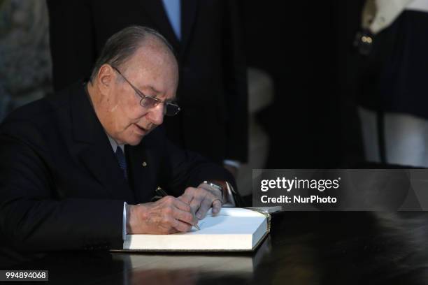 Prince Karim Aga Khan IV signs the honor book during an official visit at the Belem Palace in Lisbon, Portugal, on July 9, 2018. Prince Karim Aga...