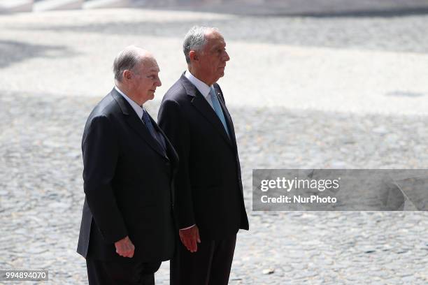 Portugal's President Marcelo Rebelo de Sousa and Prince Karim Aga Khan IV listens to the national anthems during an official visit at the Belem...