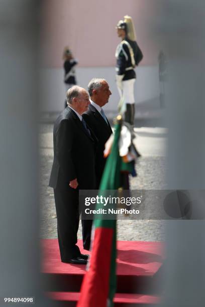 Portugal's President Marcelo Rebelo de Sousa and Prince Karim Aga Khan IV listens to the national anthems during an official visit at the Belem...