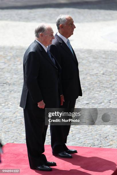 Portugal's President Marcelo Rebelo de Sousa and Prince Karim Aga Khan IV listens to the national anthems during an official visit at the Belem...