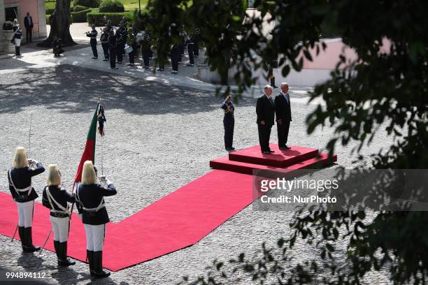 Portugal's President Marcelo Rebelo de Sousa and Prince Karim Aga Khan IV listens to the national anthems during an official visit at the Belem...