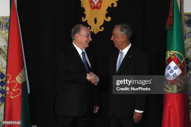 Portugal's President Marcelo Rebelo de Sousa and Prince Karim Aga Khan IV shake hands during an official visit at the Belem Palace in Lisbon,...