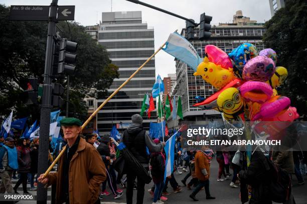 People demonstrate against the government of President Mauricio Macri and the latest deal with the International Monetary Fund, during the 202th...