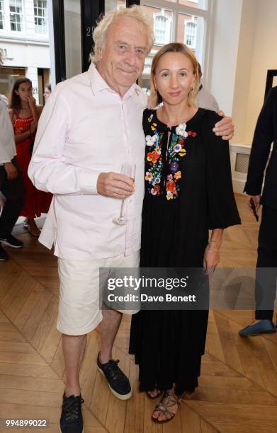 Roland Cowan and wife Jane Cowan attend the Bansky 'Greatest Hits 2002-2008" exhibition VIP preview at Lazinc on July 9, 2018 in London, England.