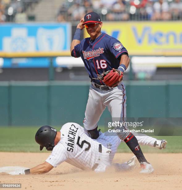 Yolmer Sanchez of the Chicago White Sox breaks up a double play by Ehire Adrianza of the Minnesota Twins in the 7th inning at Guaranteed Rate Field...
