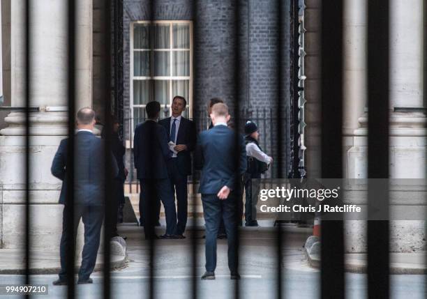 Foreign Seretary Jeremy Hunt walks through to the Foreign and Commenwealth Office from Downing Street after being newly appointed as Foreign...