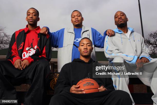 High School Basketball: Portrait of Simeon Career Academy Derrick Rose with his older brothers Dwayne, Reggie, and Allan during photo shoot in Murray...