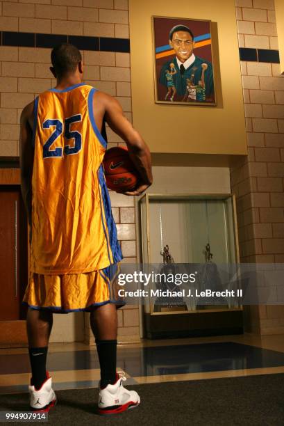 High School Basketball: Closeup portrait from rear of Simeon Career Academy Derrick Rose at Ben Wilson Gymnasium. View of Ben Wilson painting in...