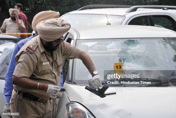 Chandigarh police takes finger prints from the gun which recovered gangster Dilpreet Singhs car while investigating, at sector 43 on July 9, 2018 in...