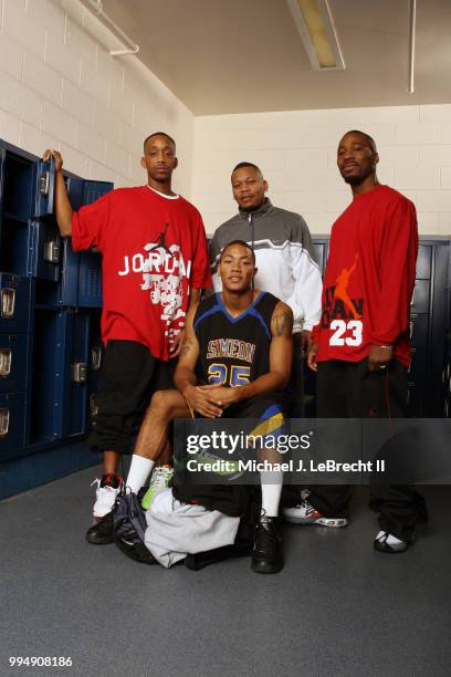 High School Basketball: Portrait of Simeon Career Academy Derrick Rose with brothers Allan, Reggie, and Dwayne during photo shoot in locker room at...