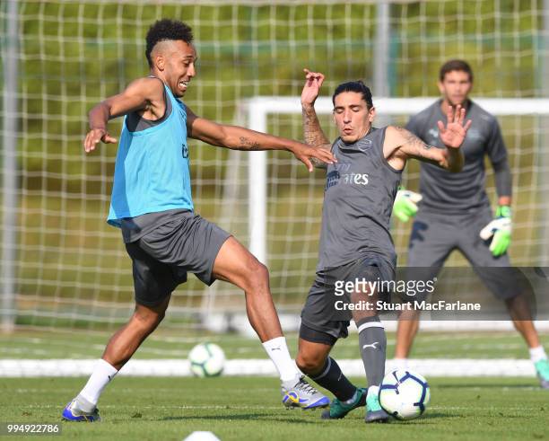 Pierre-Emerick Aubameyang and Hector Bellerin of Arsenal compete for the ball during a training session at London Colney on July 9, 2018 in St...