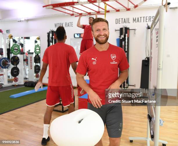 Shkodran Mustafi of Arsenal smiles during a training session at Colney on July 9, 2018 in St Albans, England.