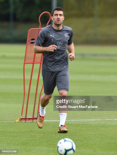 Sokratis Papastathopoulos of Arsenal runs during a training session at Colney on July 9, 2018 in St Albans, England.