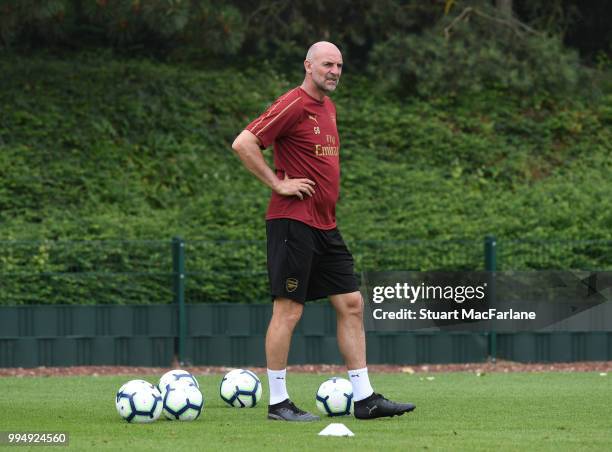 Arsenal assistant 1st team coach Steve Bould looks on during a training session at Colney on July 9, 2018 in St Albans, England.