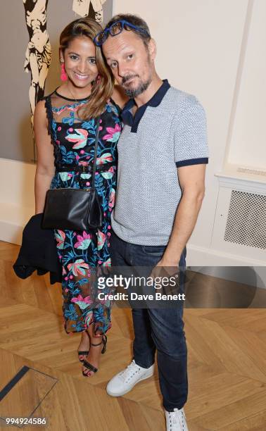 Katy Wickremesinghe and Jonathan Yeo attend the Bansky 'Greatest Hits 2002-2008" exhibition VIP preview at Lazinc on July 9, 2018 in London, England.