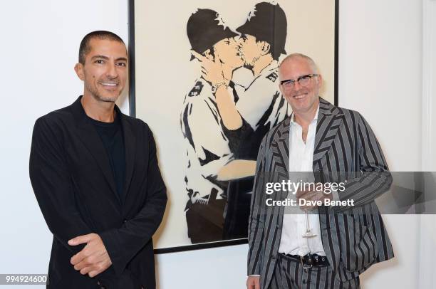 Wissam Al Mana and Joe Corre attend the Bansky 'Greatest Hits 2002-2008" exhibition VIP preview at Lazinc on July 9, 2018 in London, England.