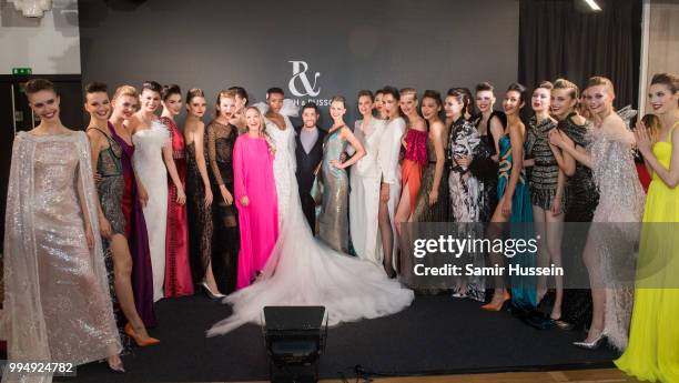 Maria Borges poses with designers Tamara Ralph and Michael Russo and other models at the Ralph & Russo Haute Couture Fall/Winter 2018-2019 show as...