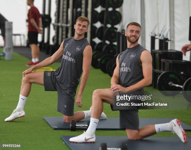 Rob Holding and Calum Chambers of Arsenal look on during a training session at London Colney on July 9, 2018 in St Albans, England.