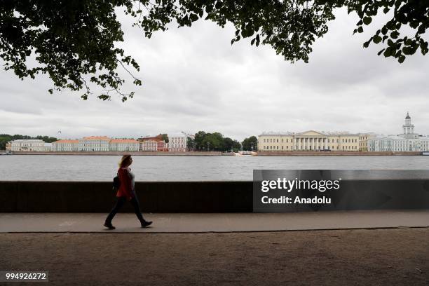 Woman walks along the Neva River in Saint Petersburg, Russia on July 09, 2018.