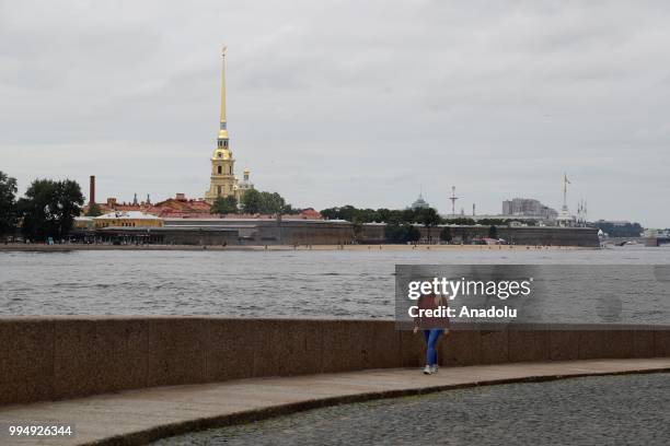 Woman walks along the Neva River in Saint Petersburg, Russia on July 09, 2018.