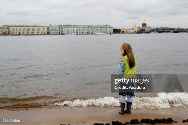 Girl watches the Neva River in Saint Petersburg, Russia on July 09, 2018.