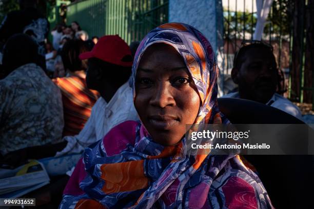 Migrants and refugees stay outside a building after being evicted 4 days ago by Italian Police, on July 9, 2018 in Rome, Italy. About 120 African...